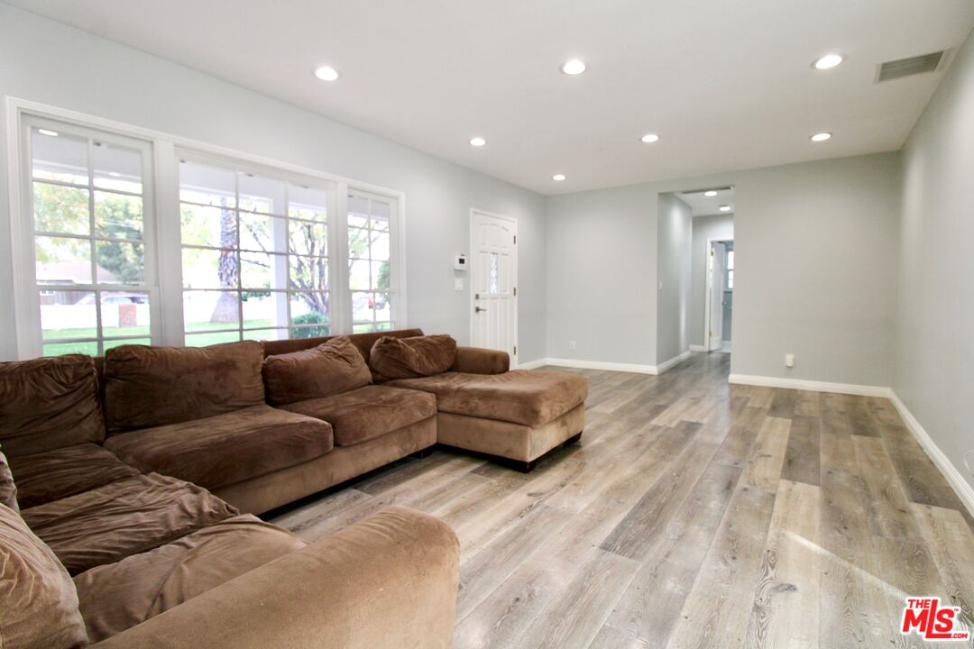 8421 Darby Avenue Northridge, CA 91325 - Photo 5 of 38 a living room with a couch and a dresser