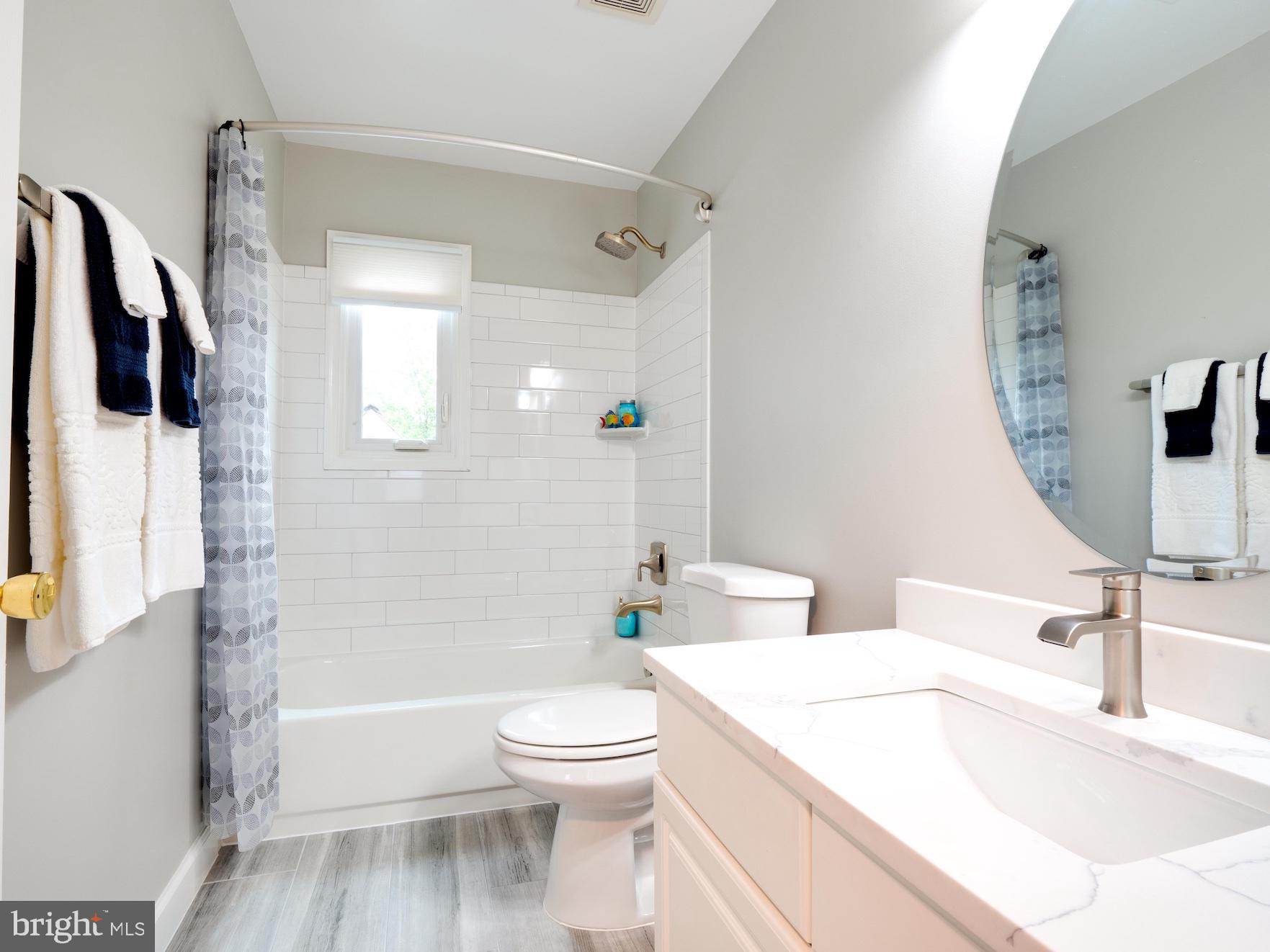 Upper Hall BA w/subway tile,new floor tiles in BAs