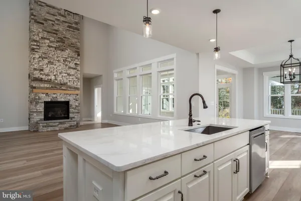 a kitchen with sink and entryway