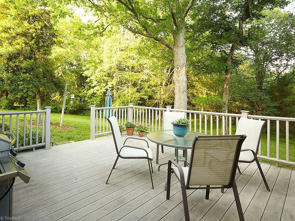 1729 Hauser Road Lewisville, NC 27023 - Photo 15 of 18 The deck provides privacy and relaxation, with lovely views of the large back yard.
