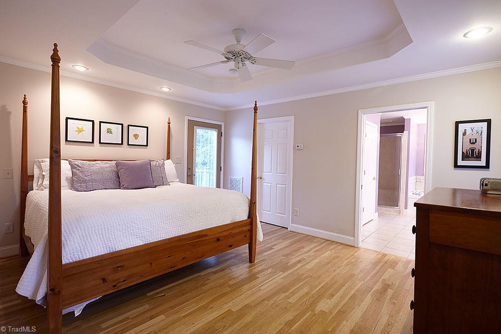 1729 Hauser Road Lewisville, NC 27023 - Photo 8 of 18 Added in 2006, this beautiful owner's suite was built with details in mind. The tray ceiling, recessed lighting and hardwood floors welcome you to this relaxing retreat.