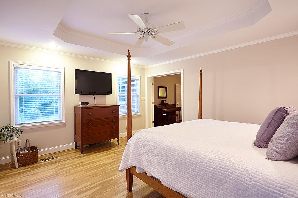 1729 Hauser Road Lewisville, NC 27023 - Photo 9 of 18 Another view of the owner's bedroom, showcasing the natural light from the large energy efficient windows.