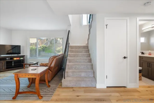 a view of a livingroom with furniture and a flat screen tv