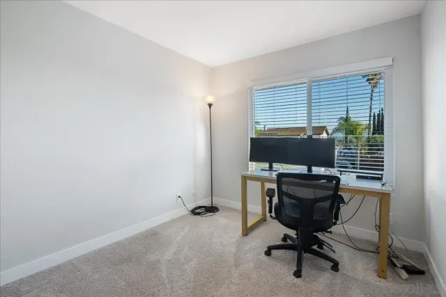 a view of a workspace with furniture