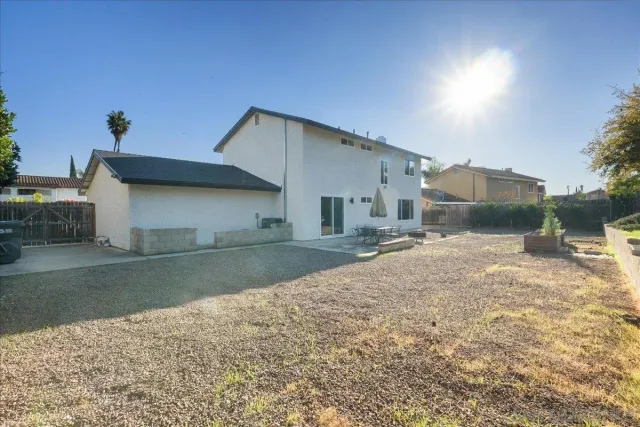 a view of a house with a yard and garage