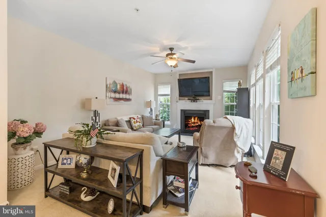 a view of a livingroom with furniture and a fireplace