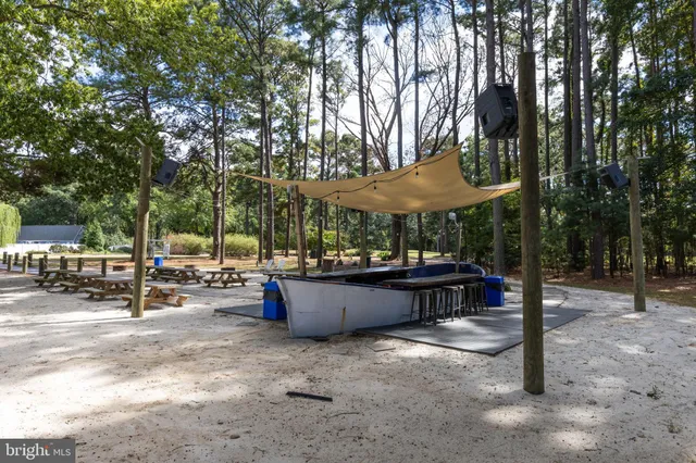 a view of outdoor space with swimming pool and sitting area