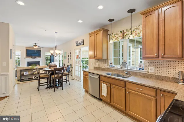 a large kitchen with a large counter top appliances and cabinets