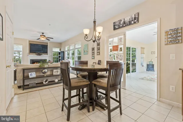 a large kitchen with a table and chairs