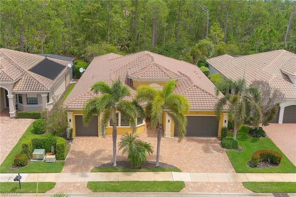 a aerial view of a house with a yard