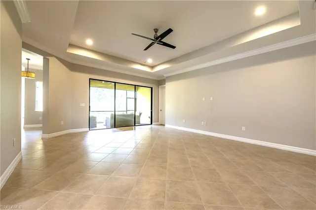 a view of a livingroom with a flat screen tv and couches in a room