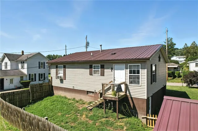 a front view of house with yard and seating