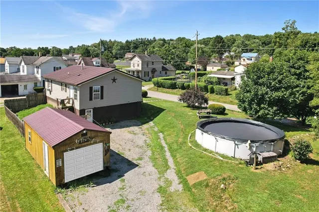 a aerial view of a house with a yard