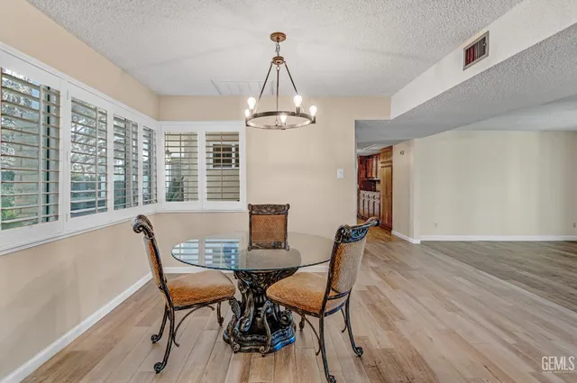 a dining room with furniture window wooden floor