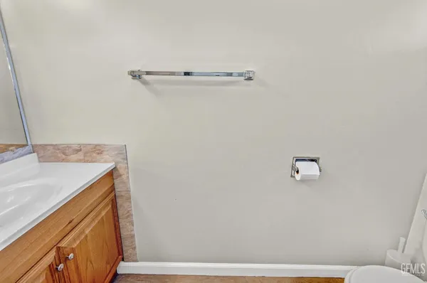 a view of house with backyard outdoor seating and barbeque oven