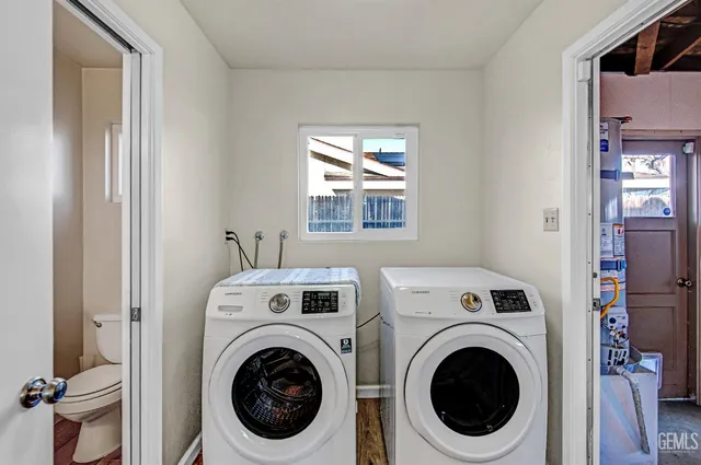 a view of storage and utility room with washer and dryer