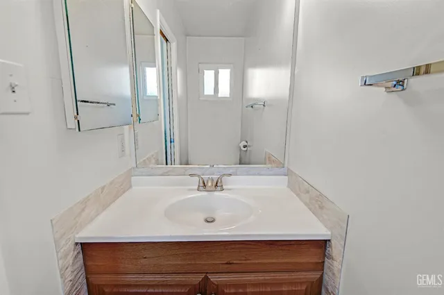 a view of hallway with wooden floor