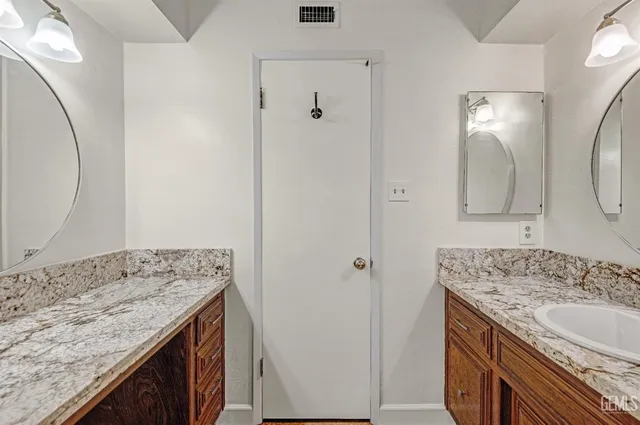a bathroom with a toilet and shower