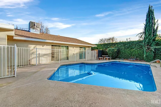 a view of swimming pool with seating area
