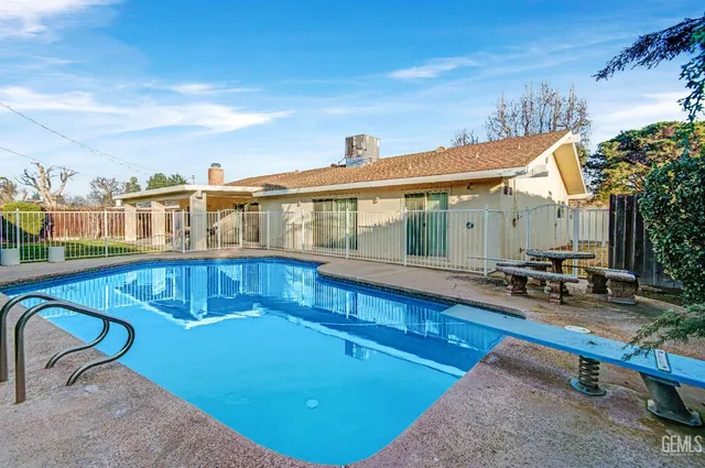 a view of a swimming pool with a patio