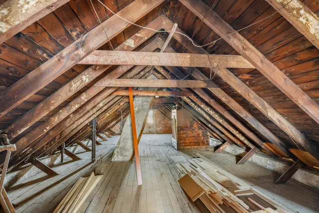 a view of a livingroom with furniture and a window