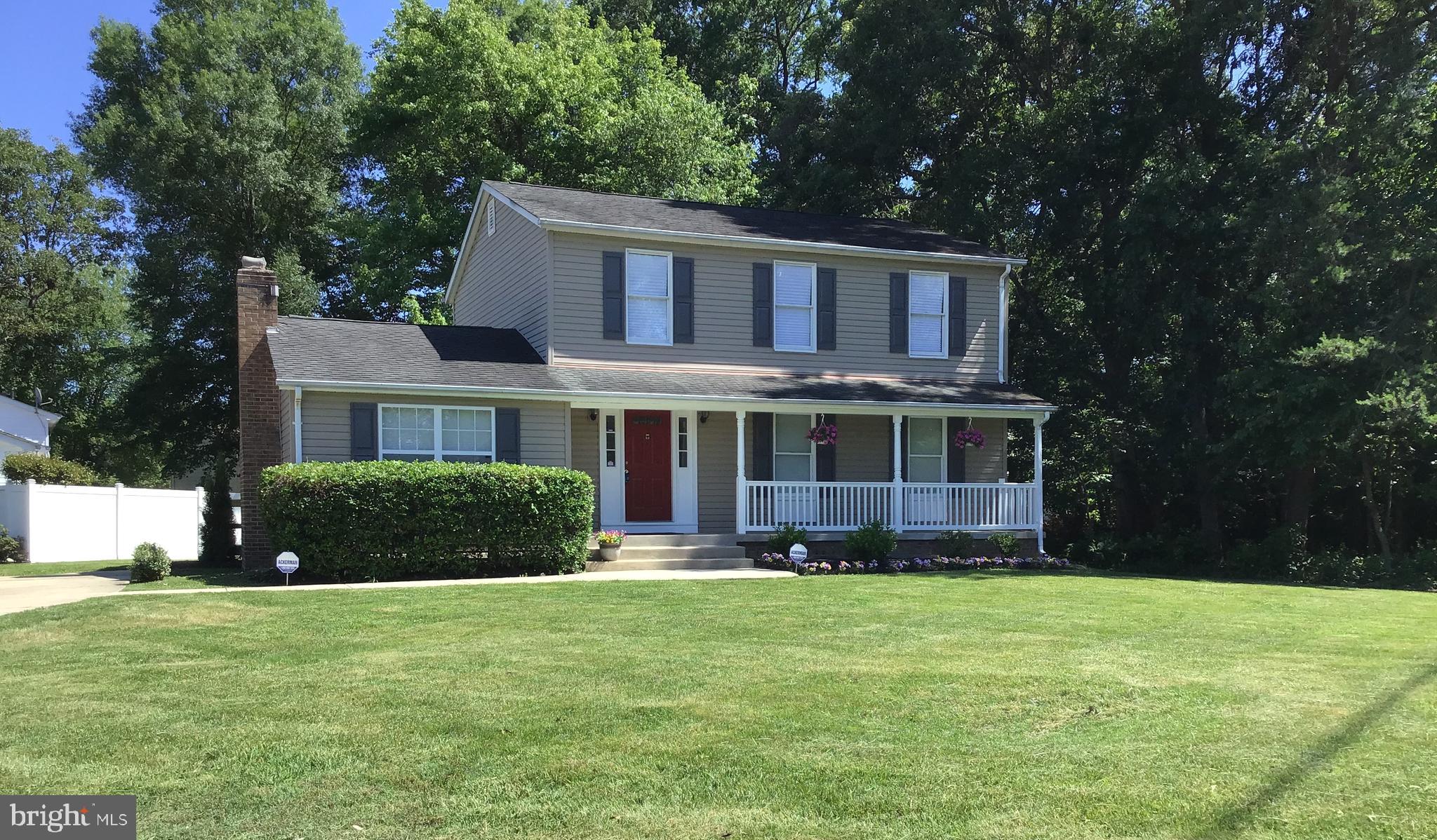 2001 Powder Horn Drive Fort Washington, MD 20744 - Photo 1 of 26 a front view of a house with a garden