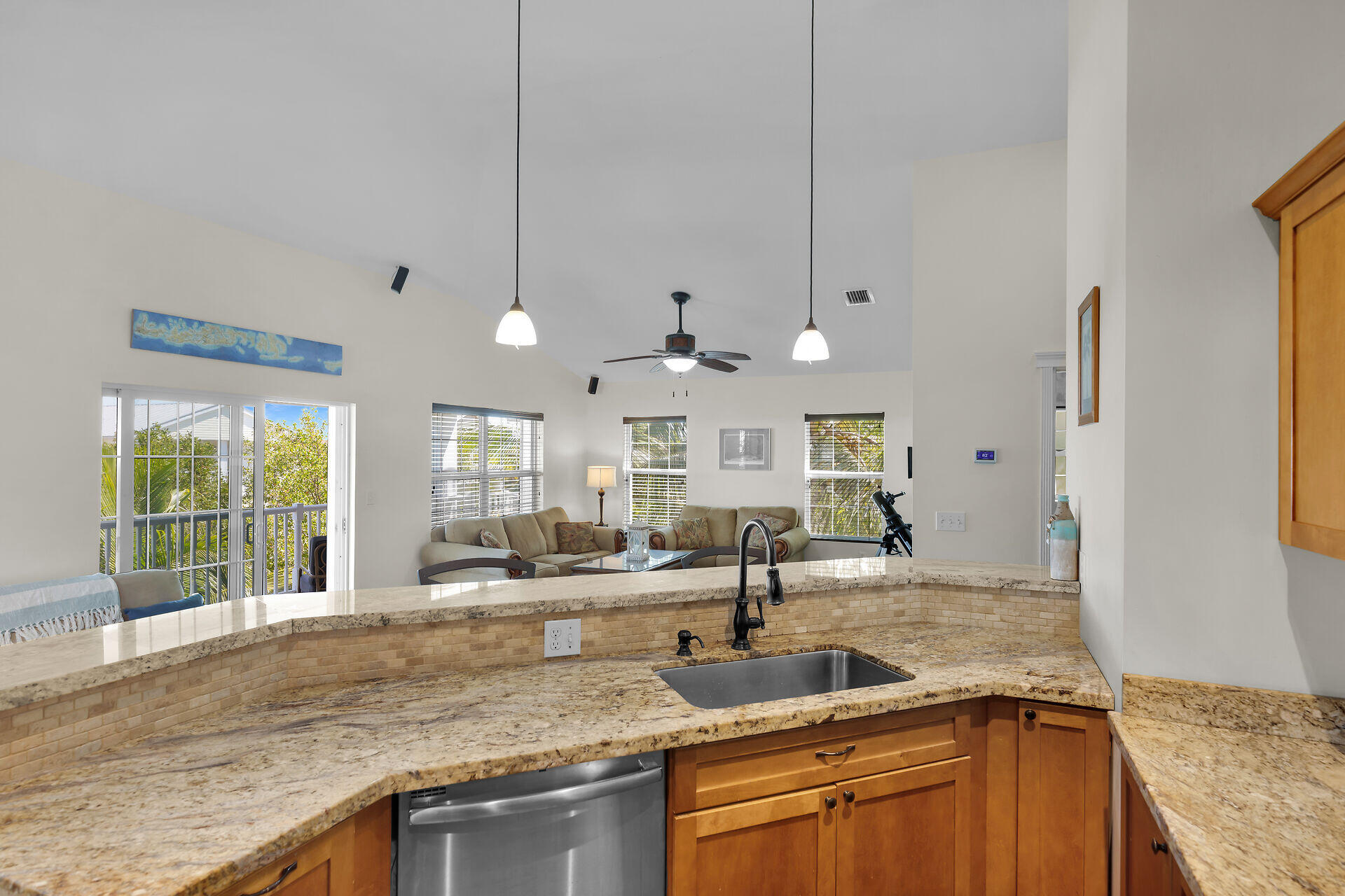 27415 Barbuda Lane Summerland Key, FL 33042 - Photo 11 of 43 a kitchen with stainless steel appliances granite countertop a sink a oven and a large window