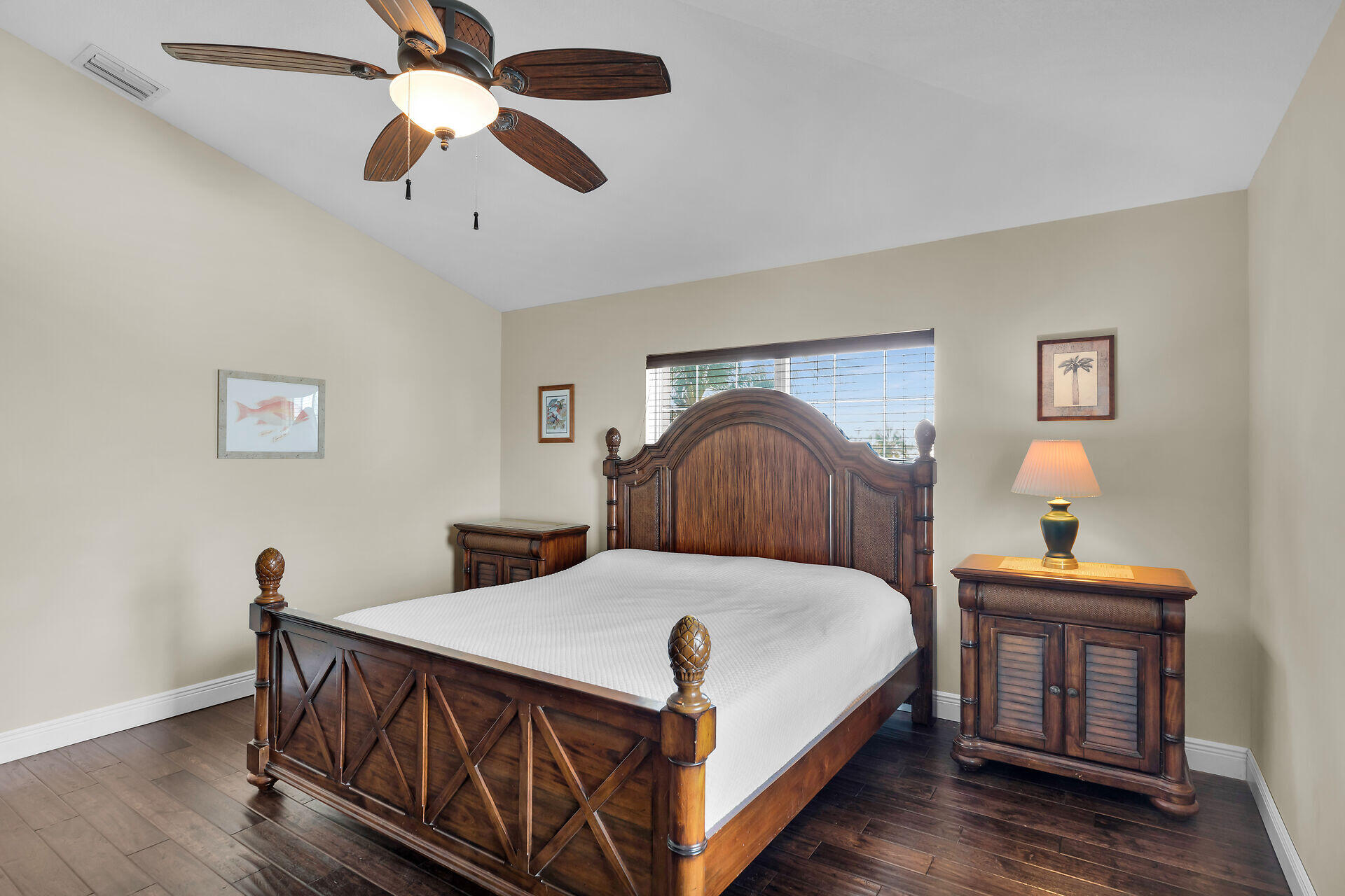 27415 Barbuda Lane Summerland Key, FL 33042 - Photo 29 of 43 a bedroom with a bed and a chandelier