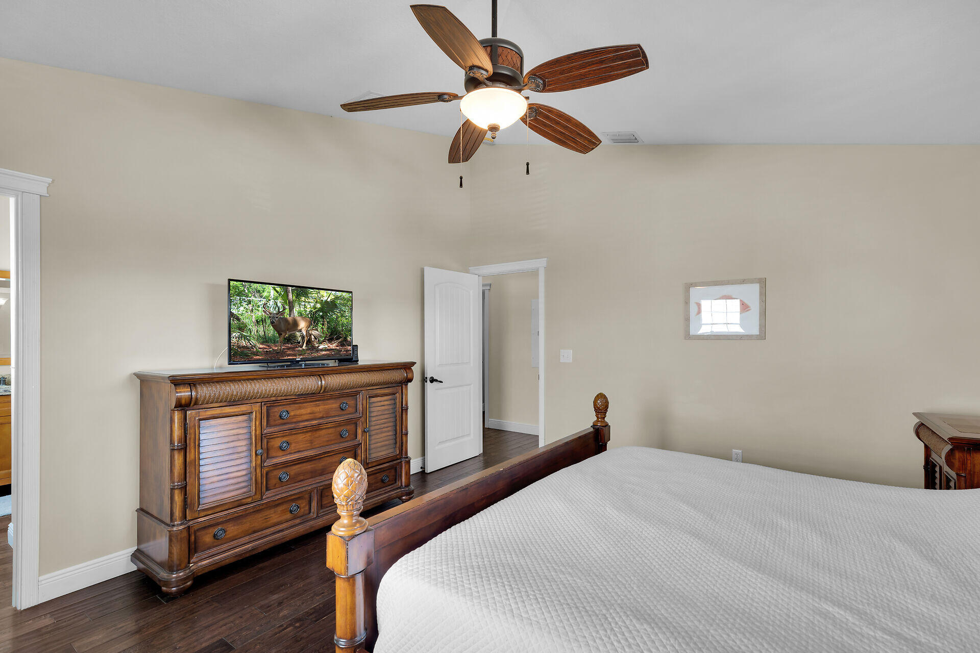 27415 Barbuda Lane Summerland Key, FL 33042 - Photo 30 of 43 a bedroom with a bed and a chandelier