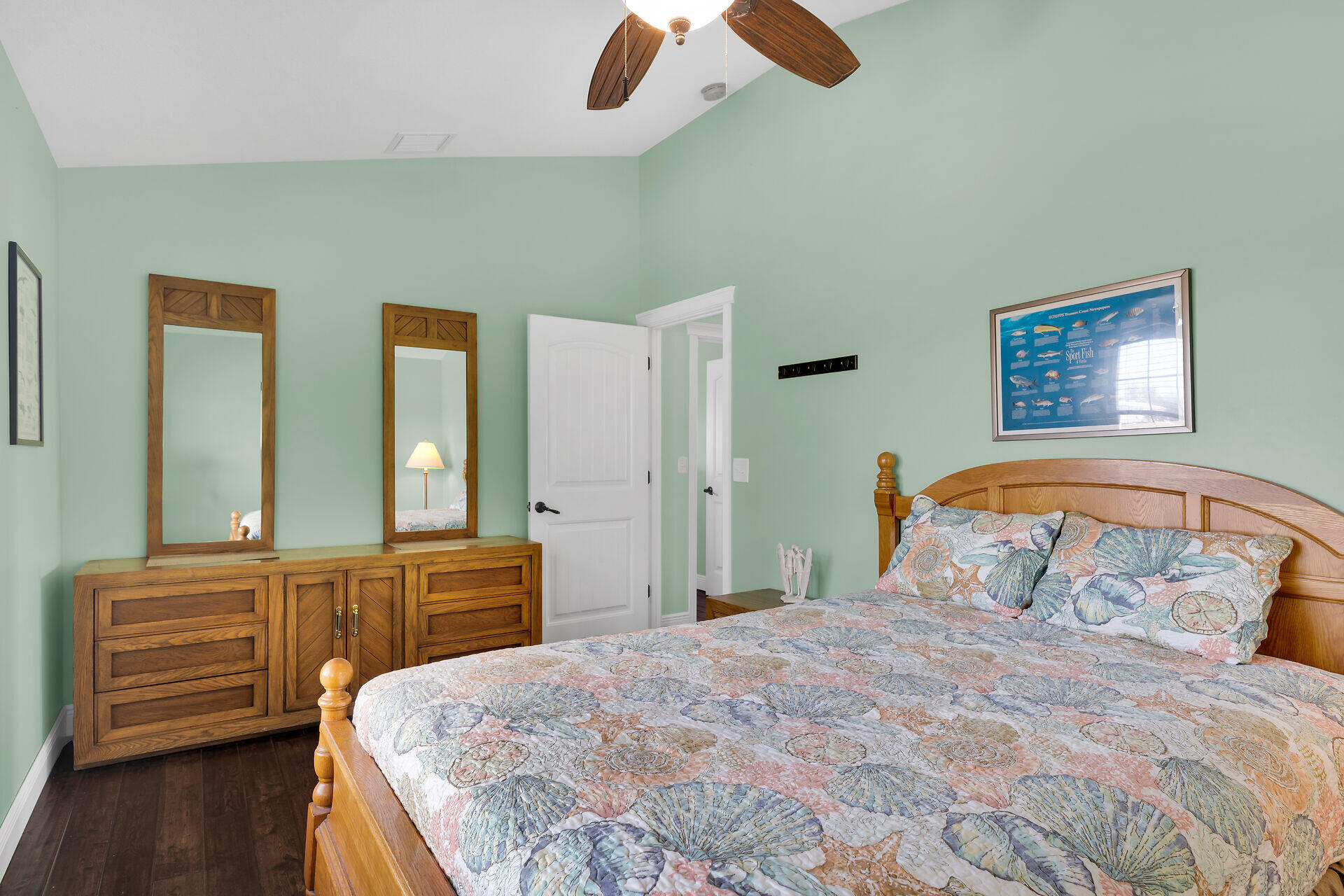 27415 Barbuda Lane Summerland Key, FL 33042 - Photo 37 of 43 a bedroom with a bed and a chandelier