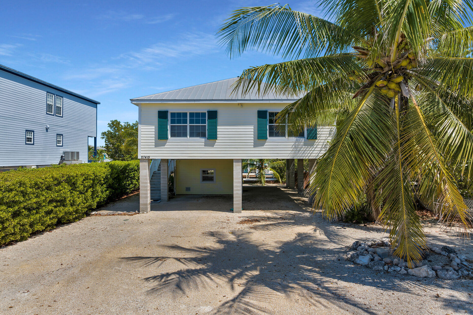 27415 Barbuda Lane Summerland Key, FL 33042 - Photo 4 of 43 a backyard of a house with seating space