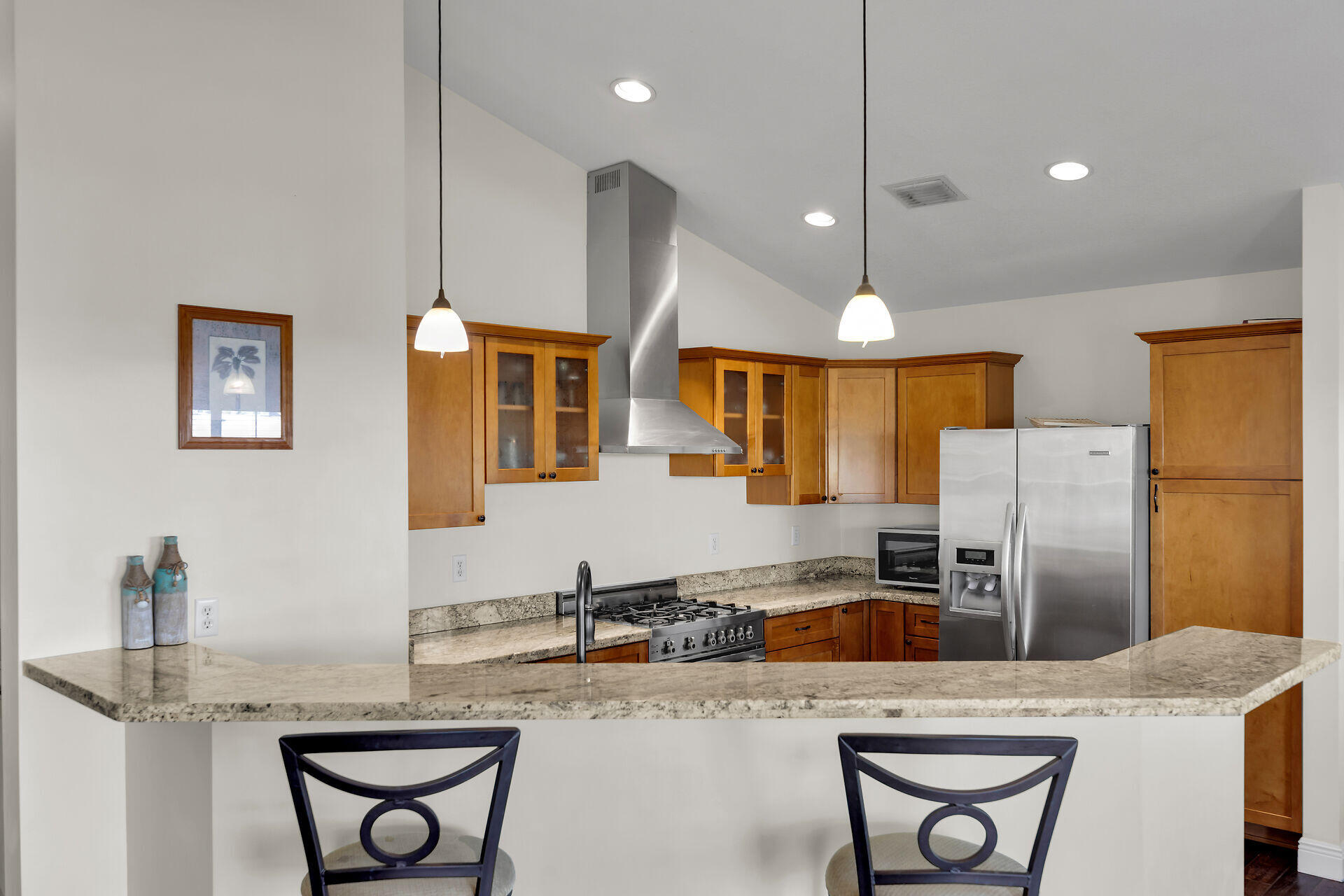 27415 Barbuda Lane Summerland Key, FL 33042 - Photo 9 of 43 a kitchen with stainless steel appliances granite countertop a sink refrigerator and cabinets