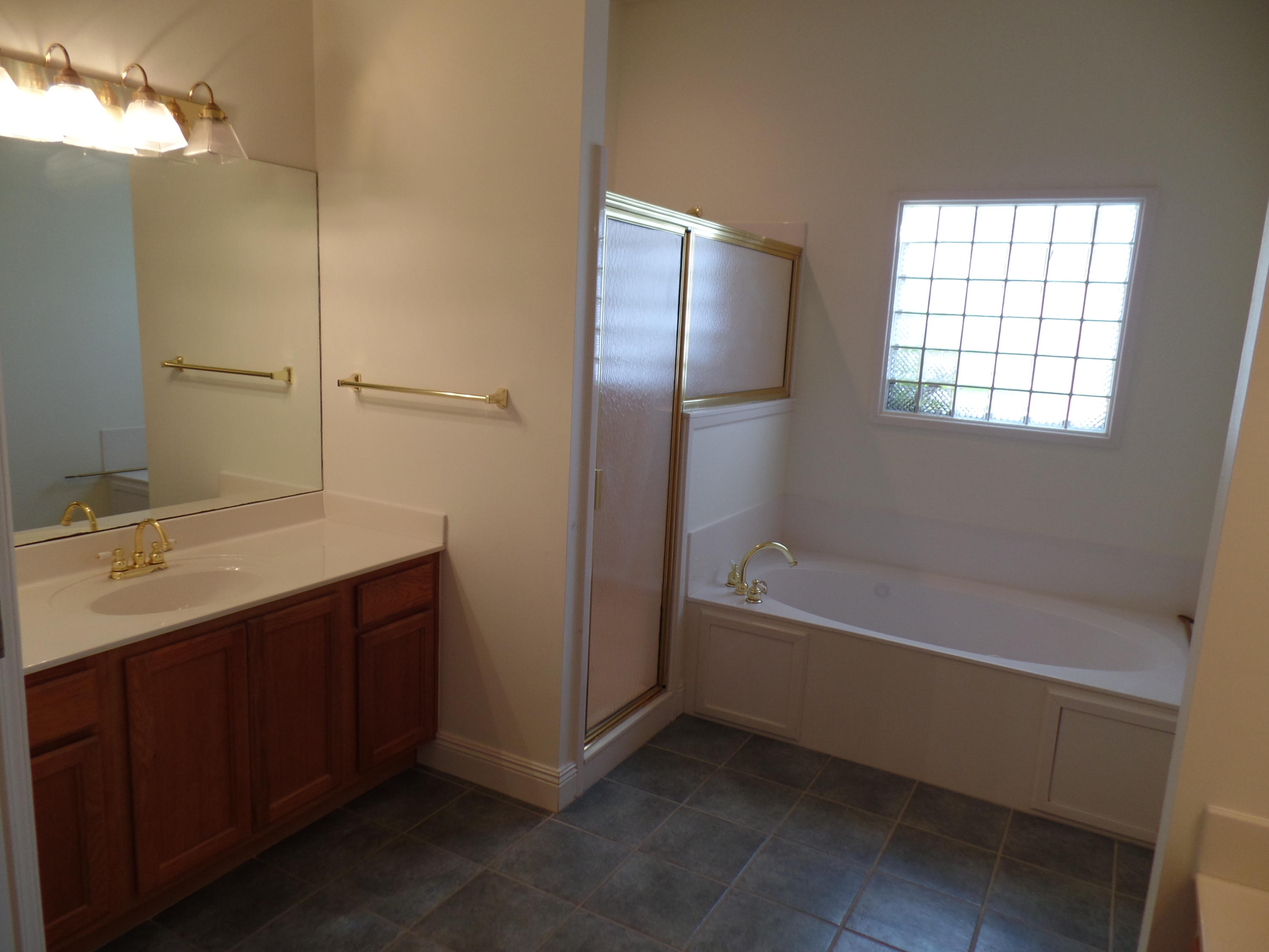 3923 Mesa Road Destin, FL 32541 - Photo 14 of 21 a bathroom with a bathtub and a sink