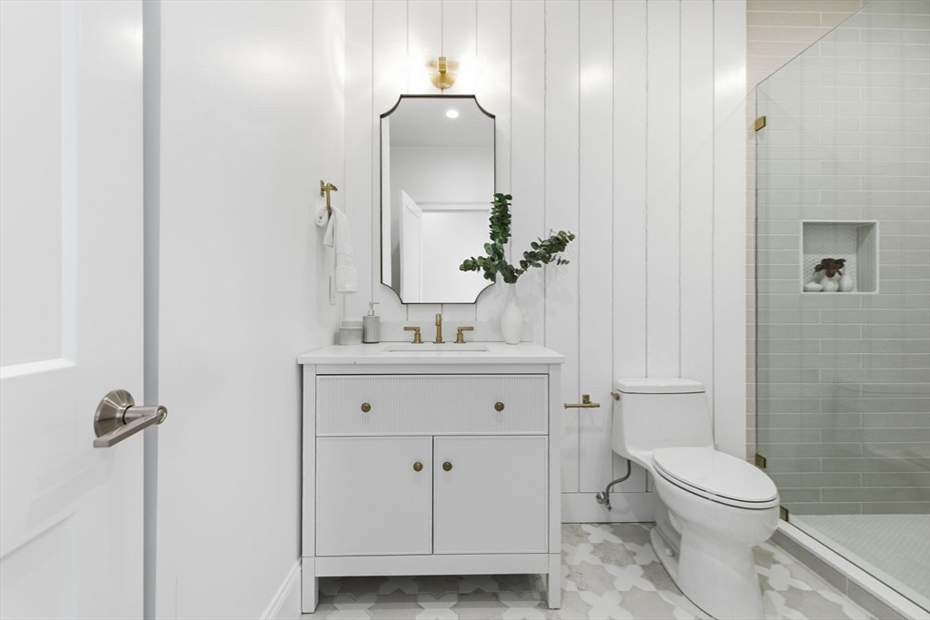 40 Foxcroft Road Winchester, MA 01890 - Photo 17 of 42 a bathroom with a toilet a sink and mirror