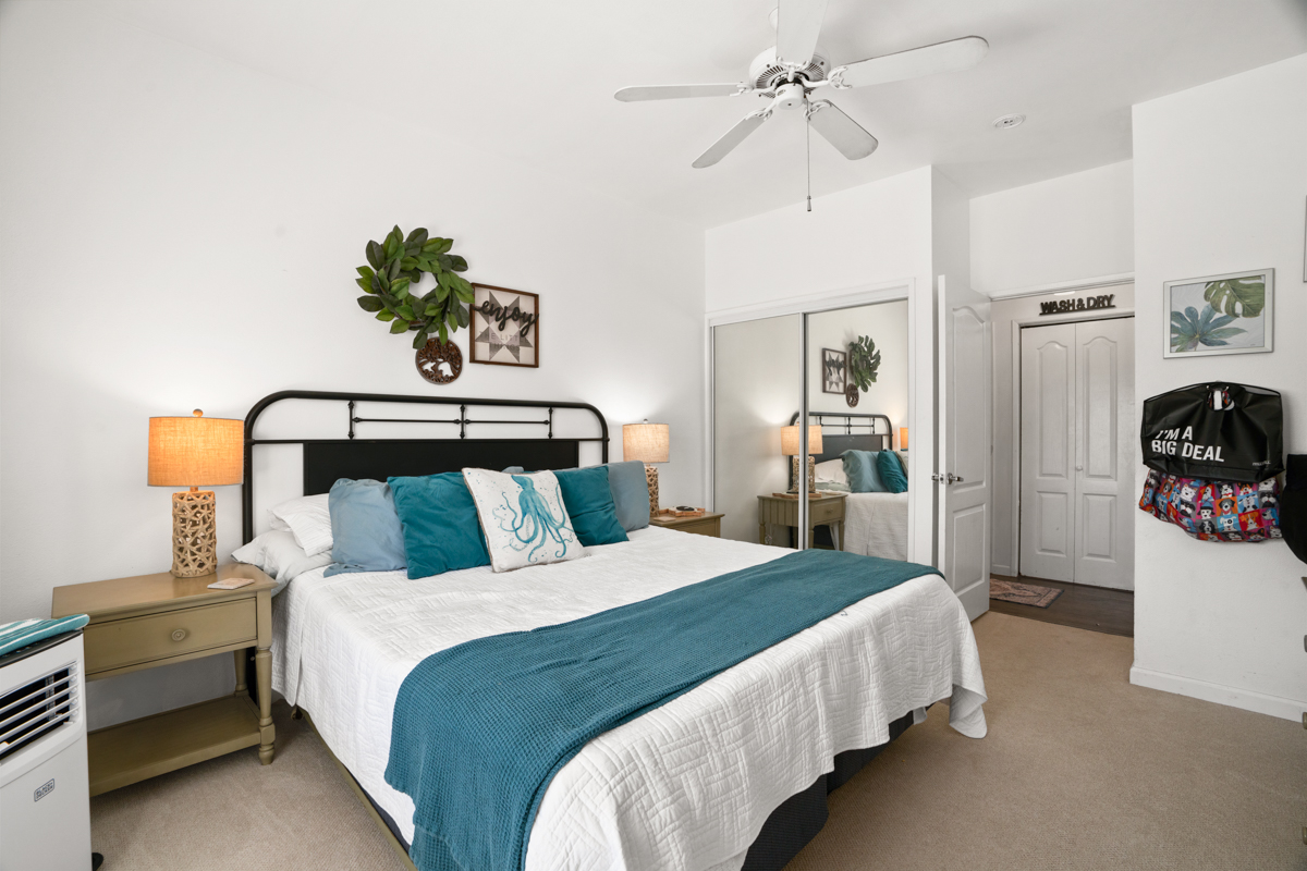 1831 Poipu Road, Unit 113 Koloa, HI 96756 - Photo 13 of 22 a bedroom with bed and window