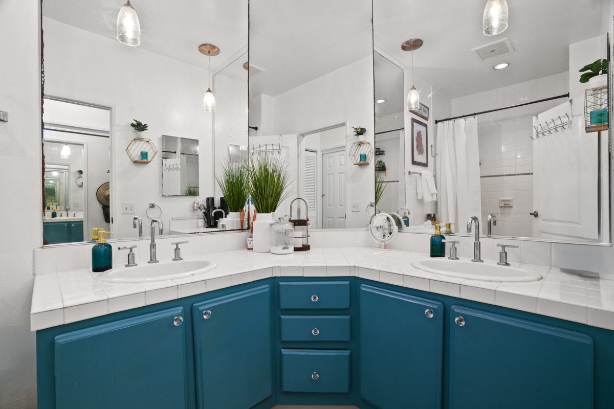 1831 Poipu Road, Unit 113 Koloa, HI 96756 - Photo 14 of 22 a bathroom with double vanity sinks and a mirror