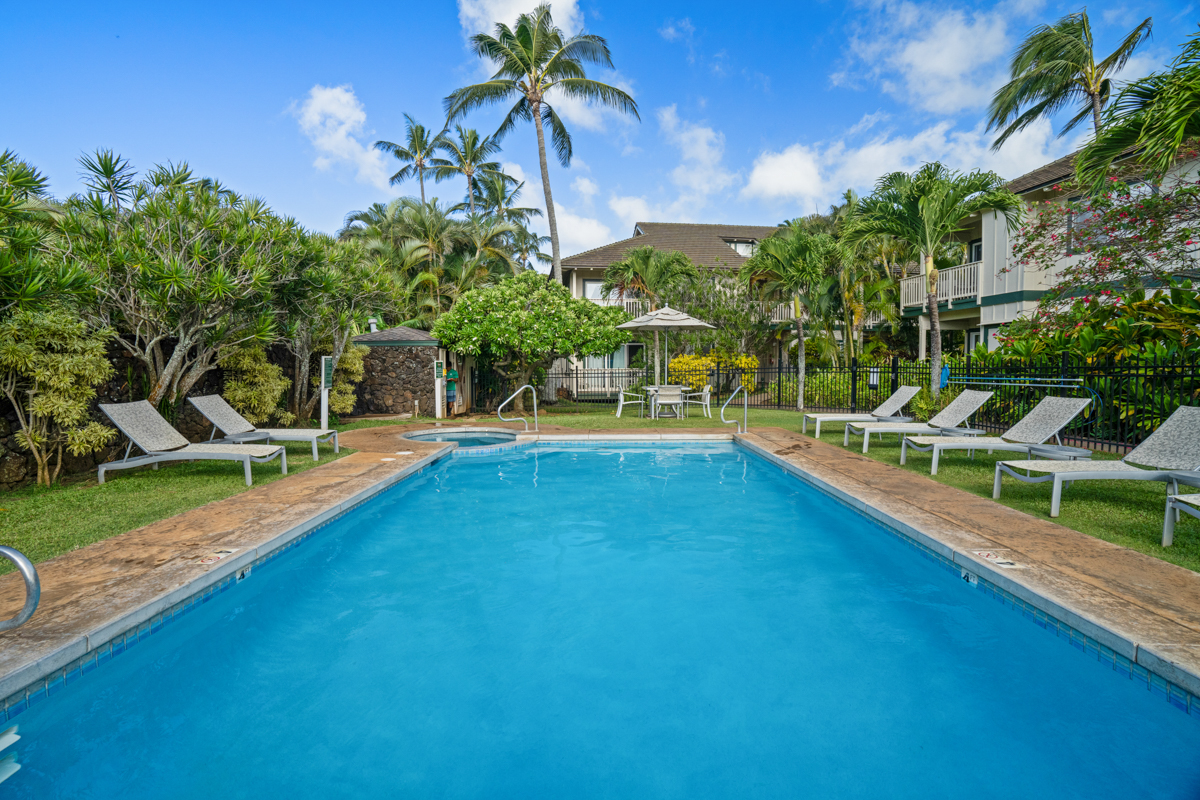 1831 Poipu Road, Unit 113 Koloa, HI 96756 - Photo 19 of 22 a view of a house with swimming pool and sitting area