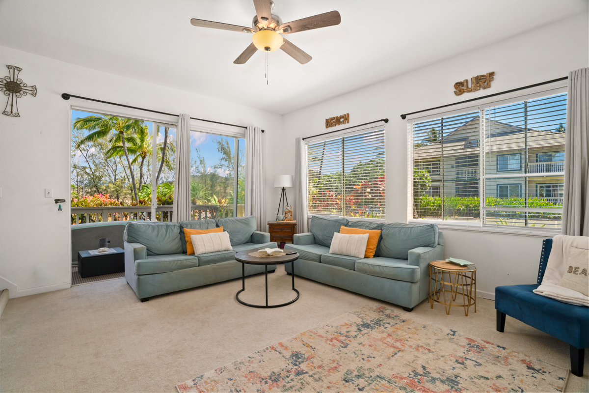 1831 Poipu Road, Unit 113 Koloa, HI 96756 - Photo 2 of 22 a living room with furniture and a large window