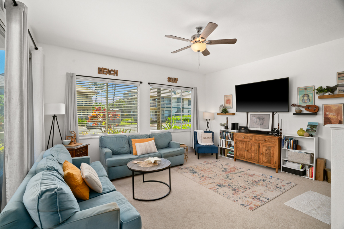 1831 Poipu Road, Unit 113 Koloa, HI 96756 - Photo 3 of 22 a living room with furniture and a flat screen tv