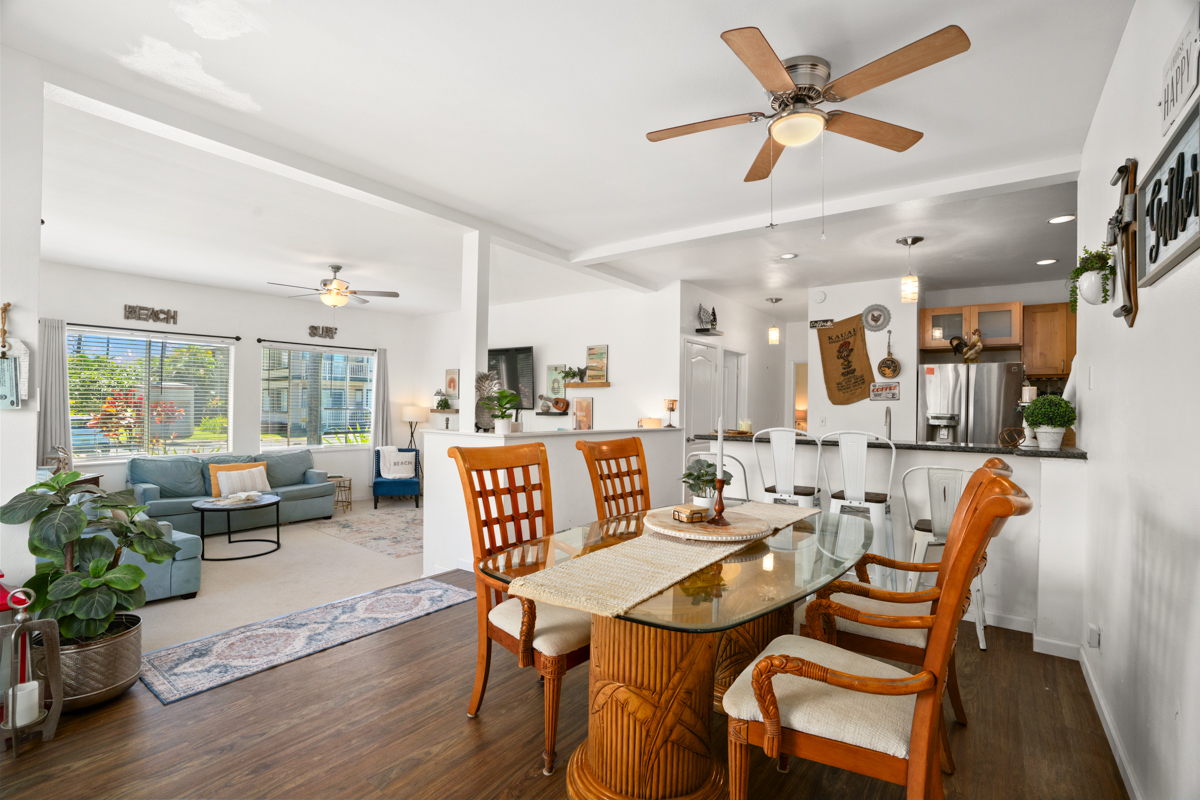 1831 Poipu Road, Unit 113 Koloa, HI 96756 - Photo 8 of 22 a view of a dining room with furniture window and wooden floor