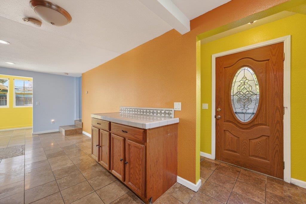 107 Behler Road Watsonville, CA 95076 - Photo 13 of 43 a view of a kitchen with fridge and wooden floor