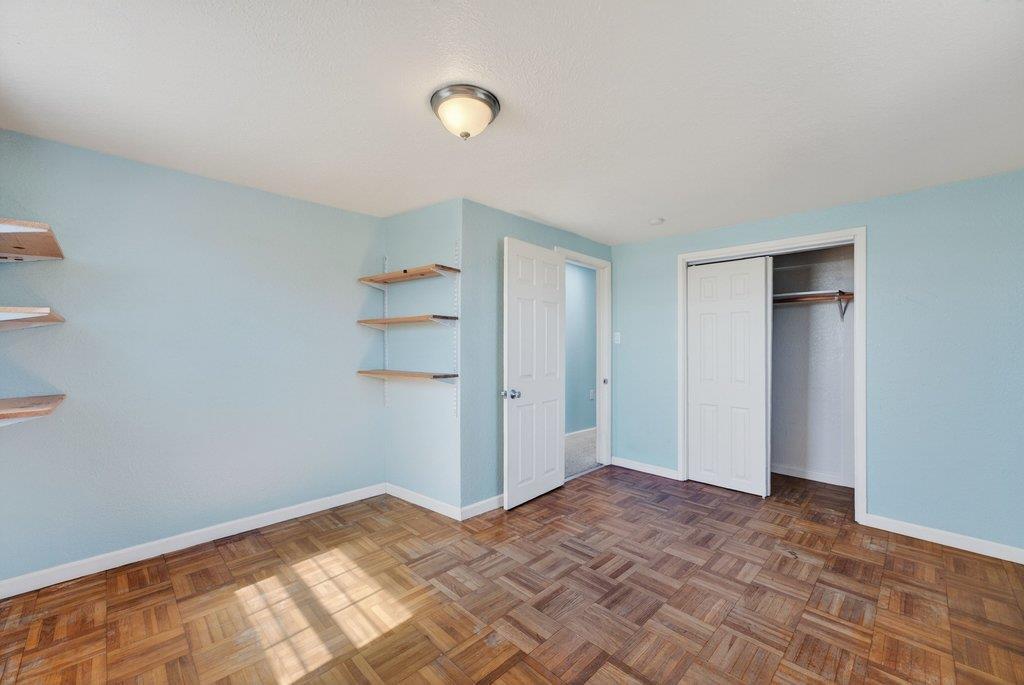 107 Behler Road Watsonville, CA 95076 - Photo 24 of 43 a view of a bedroom with wooden floor and closet