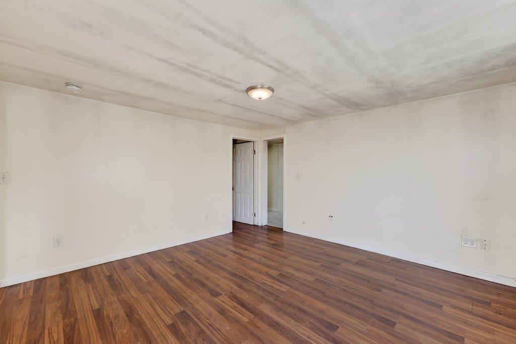 107 Behler Road Watsonville, CA 95076 - Photo 28 of 43 a view of an empty room with wooden floor