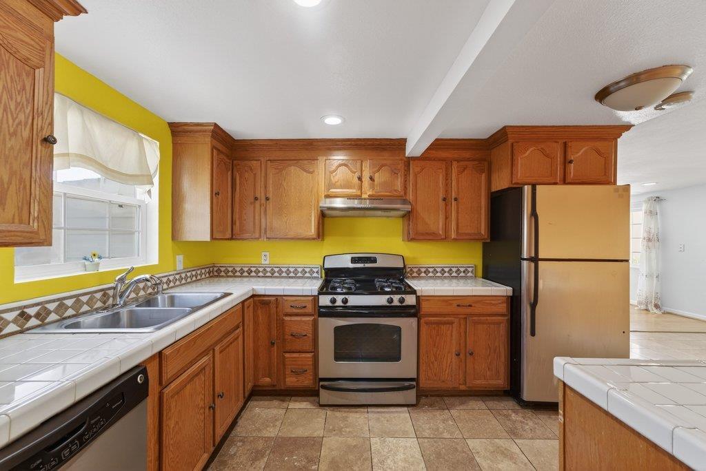 107 Behler Road Watsonville, CA 95076 - Photo 7 of 43 a kitchen with a stove sink and refrigerator