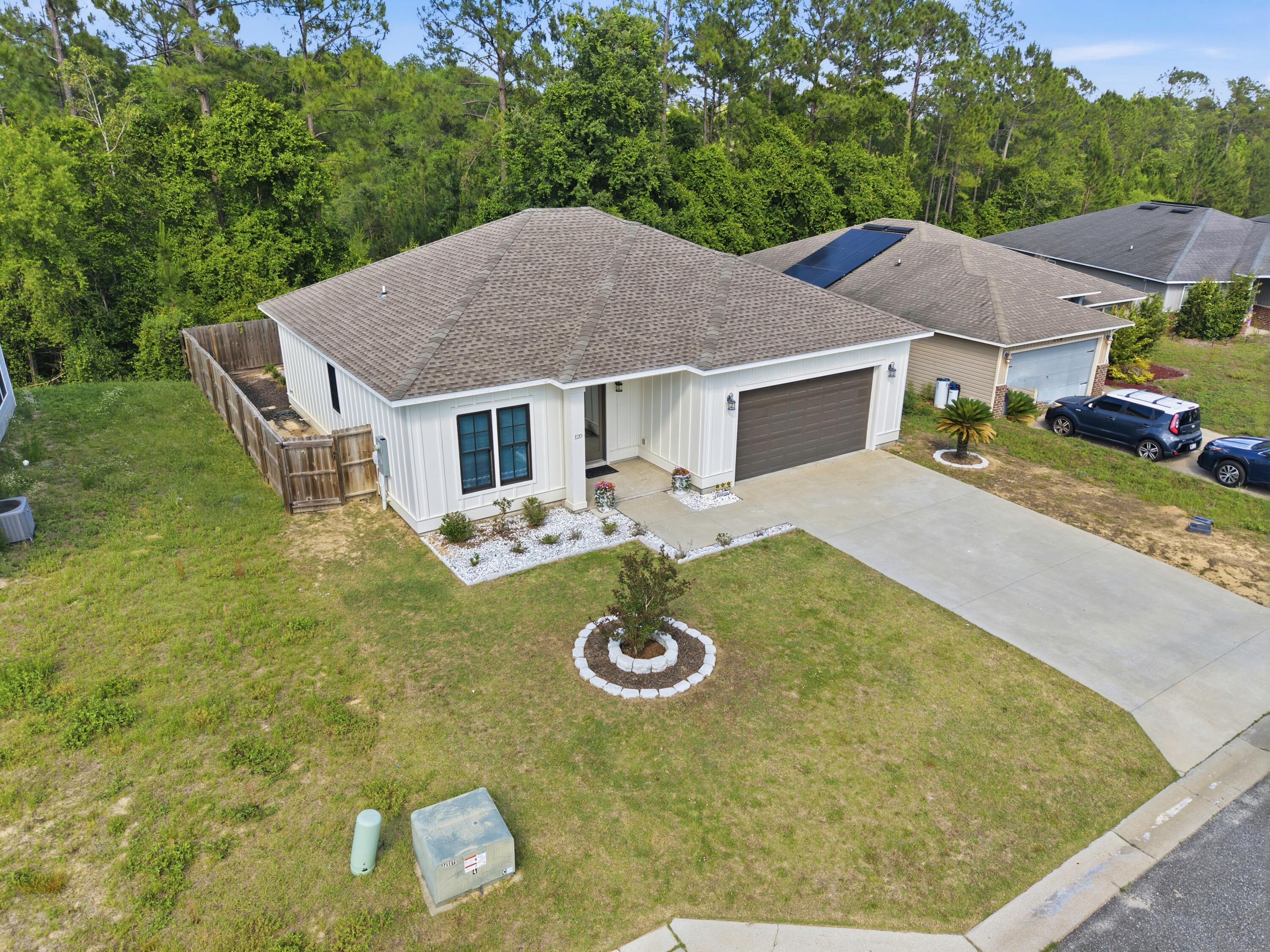 120 Lillian Way Crestview, FL 32536 - Photo 6 of 67 a aerial view of a house with swimming pool and patio