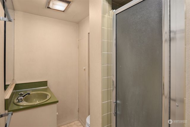 a bathroom with a sink and toilet