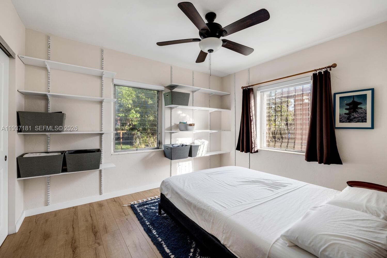 424 Northwest 53rd Street Miami, FL 33127 - Photo 14 of 20 a bed room with a bed window and a couch