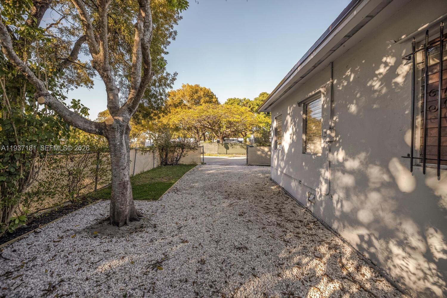 424 Northwest 53rd Street Miami, FL 33127 - Photo 20 of 20 a view of a yard with plants and trees