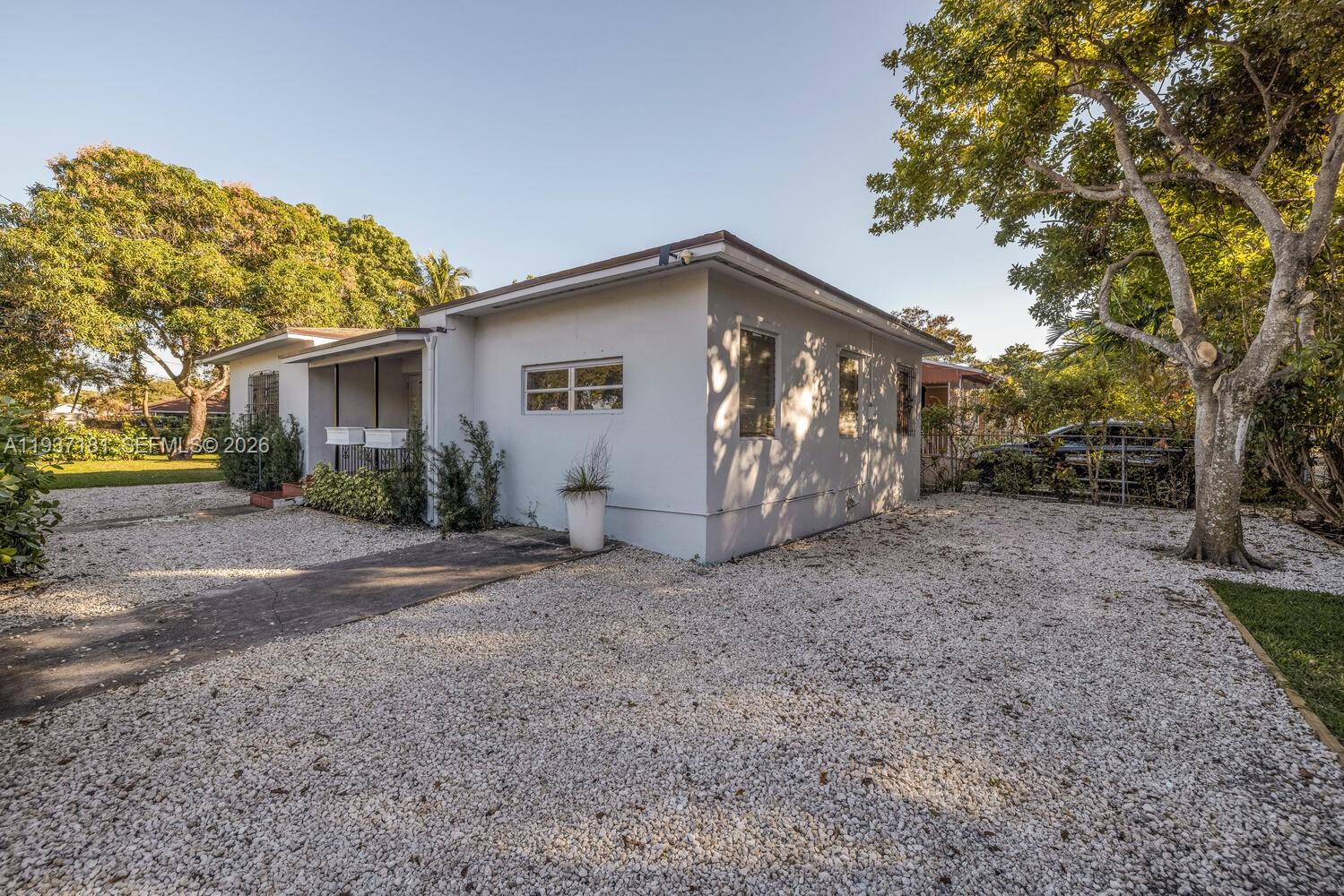 424 Northwest 53rd Street Miami, FL 33127 - Photo 3 of 20 a view of a house with a backyard