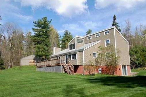 55 Worthing Road Manchester, ME 04351 - Photo 1 of 32 Rear of the home with large lawn and...